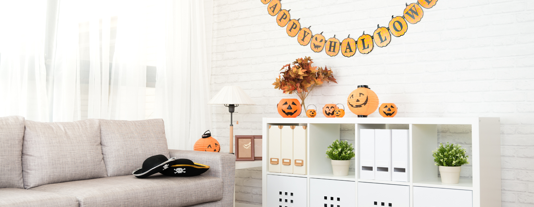  A cozy living room is decorated for Halloween, featuring a 